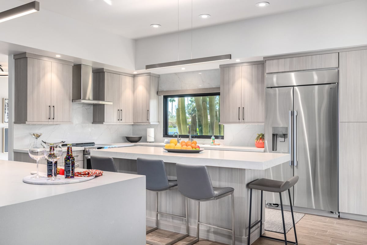 Bright kitchen remodel with window views and fruit centerpiece by Kitchens by Good Guys in Fountain Hills, AZ.