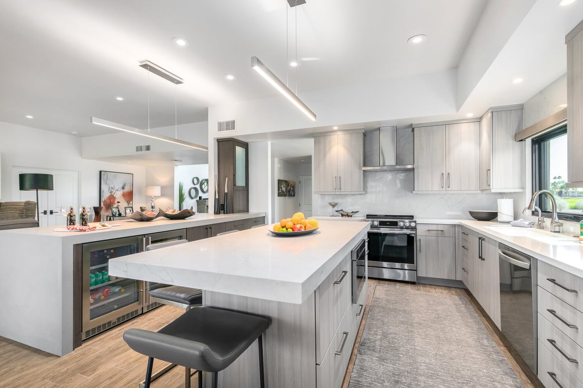Full kitchen remodel showcasing center island and wine fridge by Kitchens by Good Guys in Scottsdale, AZ.