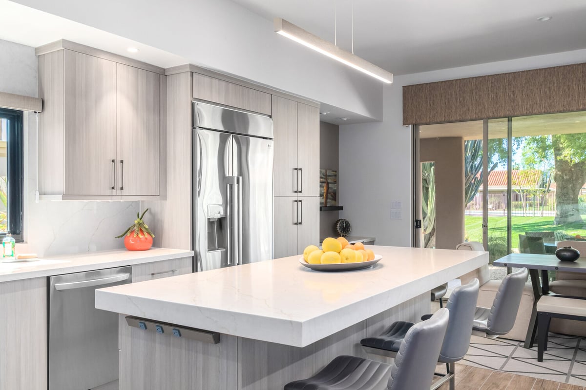 Kitchen remodel detail showing stainless appliances and island seating by Kitchens by Good Guys in Paradise Valley, AZ.