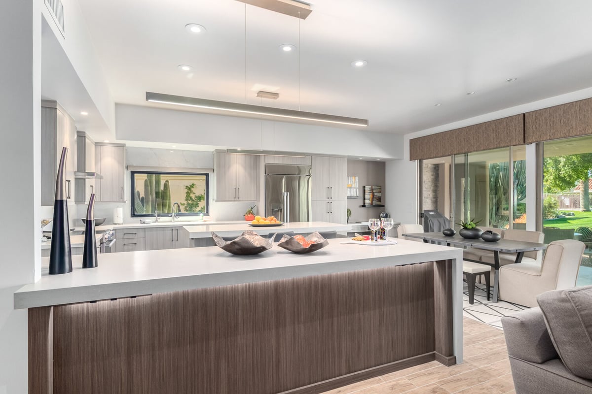 Wide view of open kitchen and dining area in Scottsdale, AZ home remodeled by Kitchens by Good Guys.