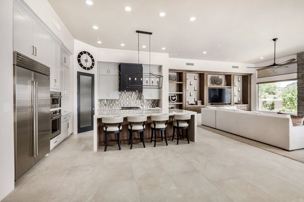 Bright and open kitchen and living space featuring full-height cabinetry by Kitchens by Good Guys in Arizona.