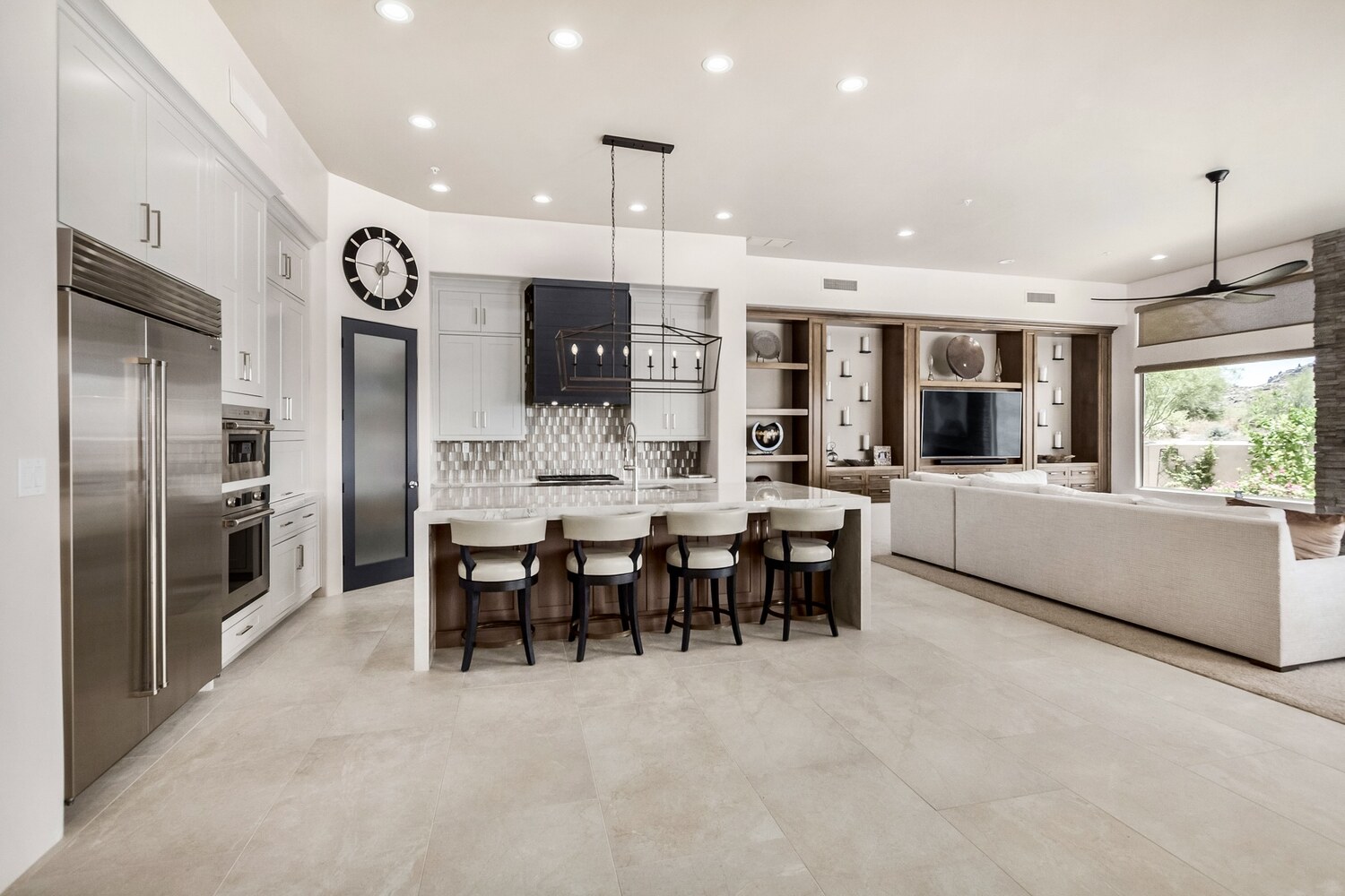 Bright and open kitchen and living space featuring full-height cabinetry by Kitchens by Good Guys in Arizona. Bright and open kitchen and living space featuring full-height cabinetry by Kitchens by Good Guys in Arizona.
