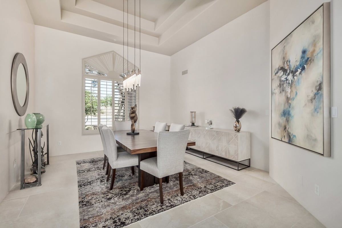 Elegant dining room remodel with sculpture centerpiece and statement lighting by Kitchens by Good Guys in Arizona.