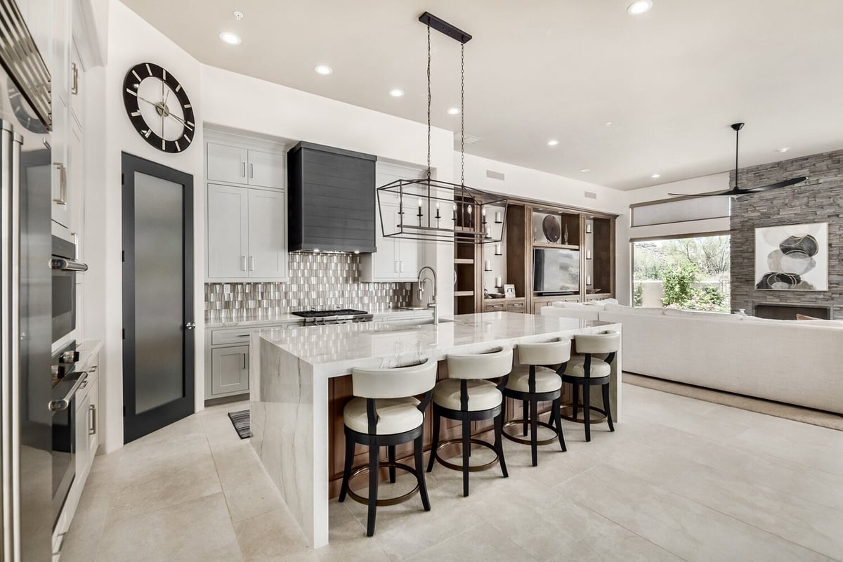 Expansive open-concept kitchen and living room design in a Fountain Hills custom home by Kitchens by Good Guys.