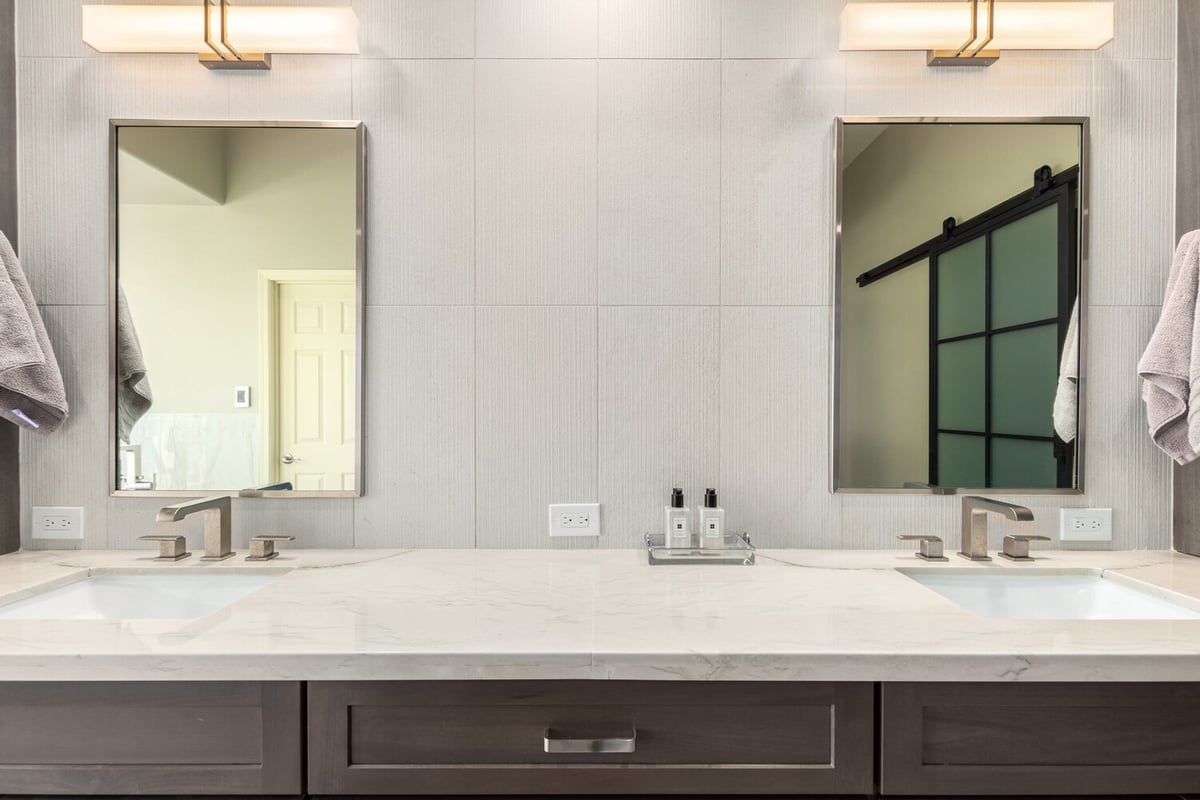 Dual sink vanity with marble countertop in Fountain Hills, AZ bathroom remodel by Kitchens by Good Guys.