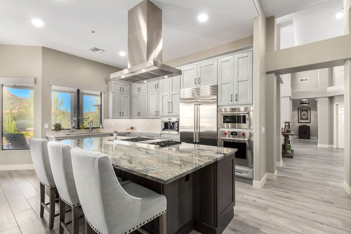 Elegant custom kitchen remodel with marble island and premium appliances by Kitchens by Good Guys in Phoenix, AZ.