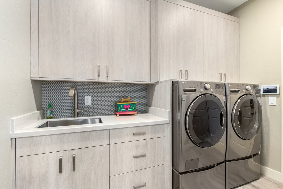 Laundry room remodel with stainless washer and dryer by Kitchens by Good Guys in Phoenix, AZ.