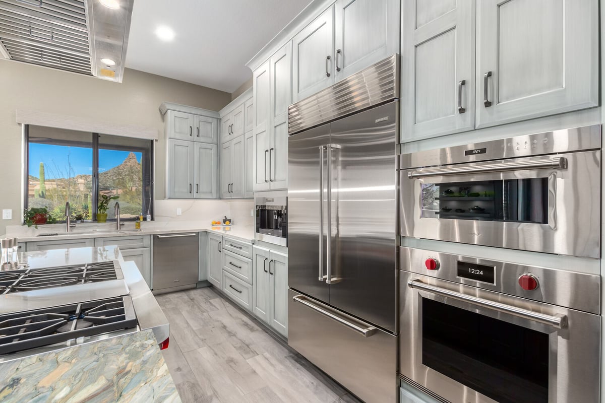 Premium kitchen appliance wall with built-in microwave and oven in Paradise Valley, AZ home by Kitchens by Good Guys.