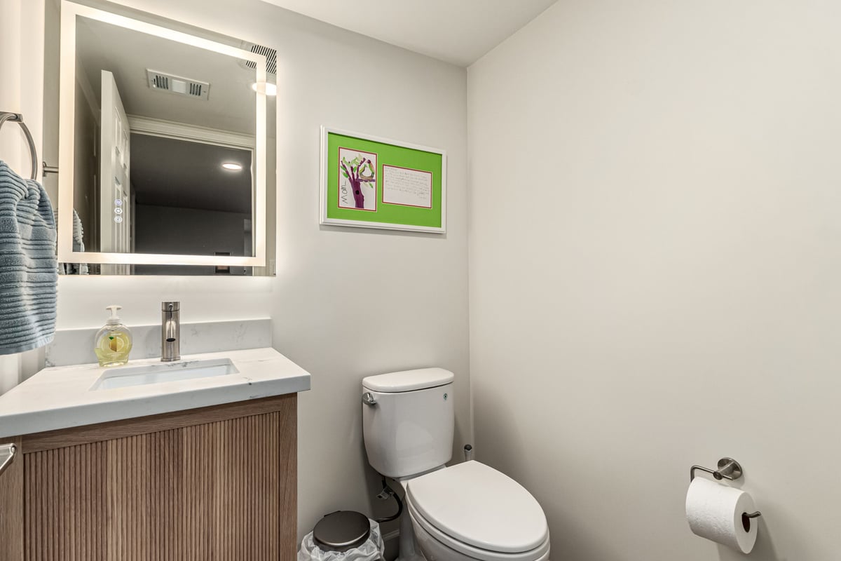 Compact bathroom design with lighted mirror in Scottsdale renovation by Kitchens by Good Guys.