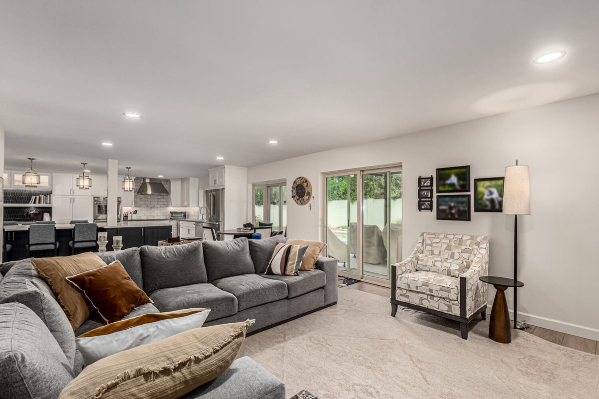 Spacious open living space with sectional and modern kitchen in Scottsdale custom home renovation by Kitchens by Good Guys.