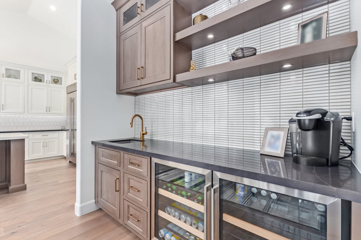 Close-up of custom bar cabinetry with decorative backsplash in Scottsdale, AZ by Kitchens by Good Guys.