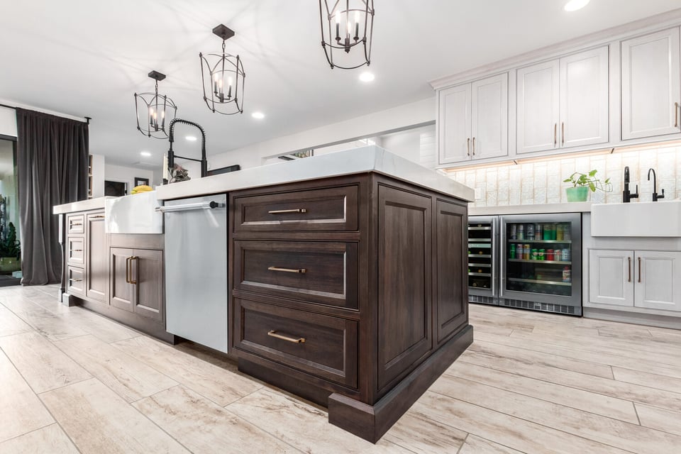 Angled view of two-tone kitchen island and bar stools in Paradise Valley custom home by Kitchens by Good Guys.