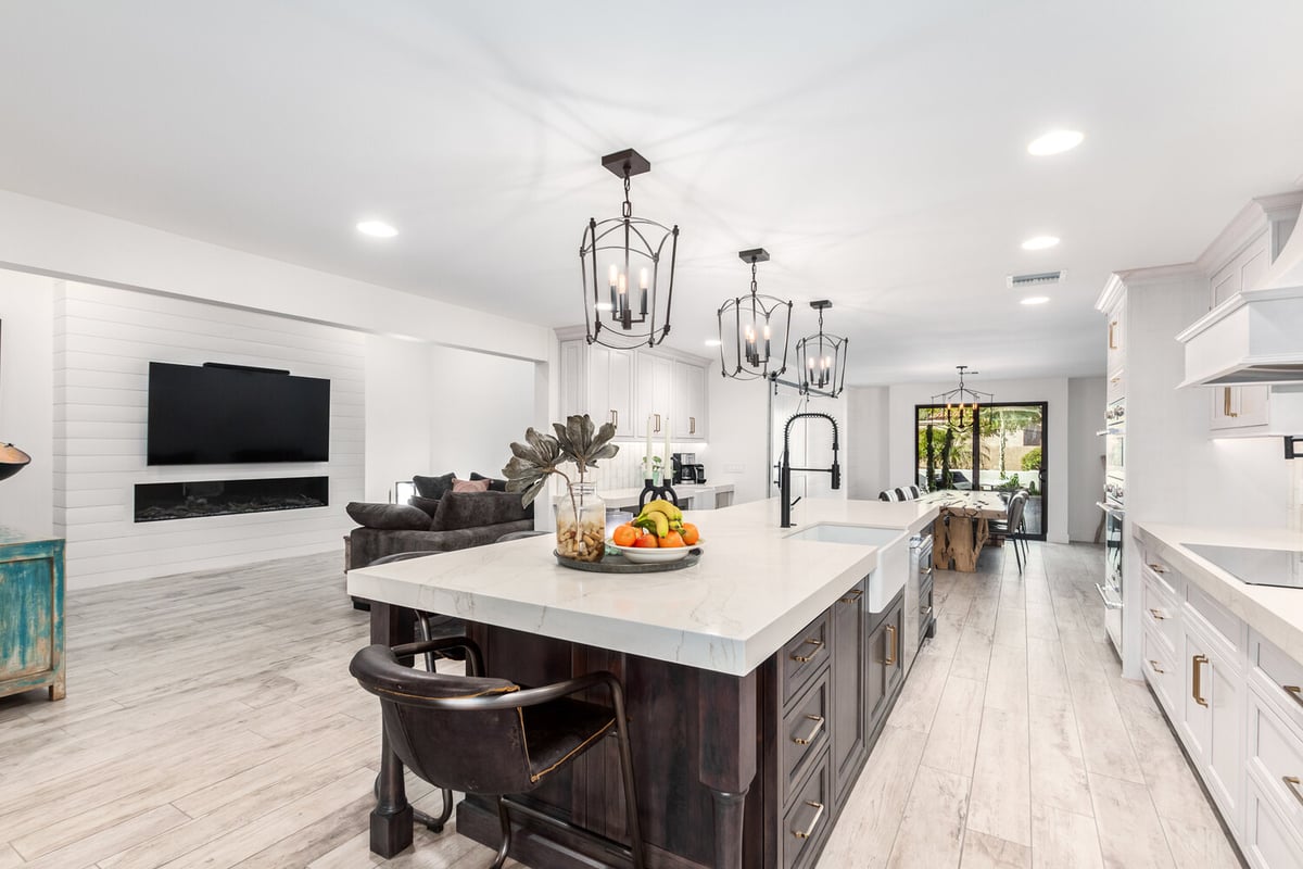 Bright luxury kitchen with double fridge and seating in Paradise Valley custom home by Kitchens by Good Guys.