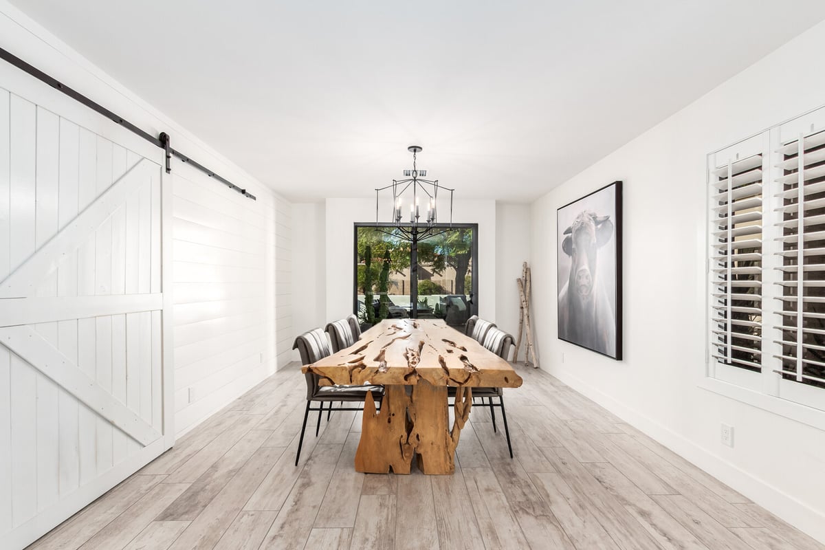 Custom dining area with natural light and live-edge table in Mesa home by Kitchens by Good Guys.