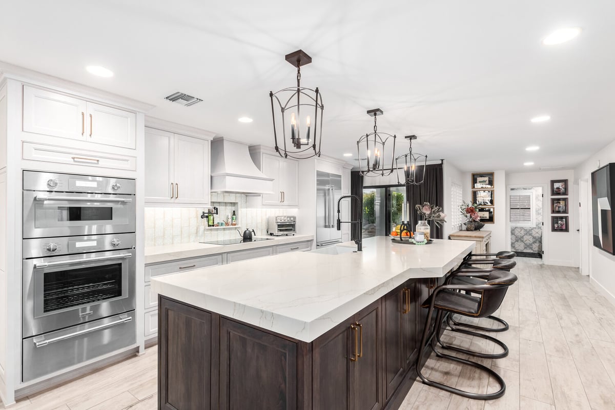 Luxury kitchen island with pendant lighting in custom home remodel by Kitchens by Good Guys in Rio Verde, AZ.