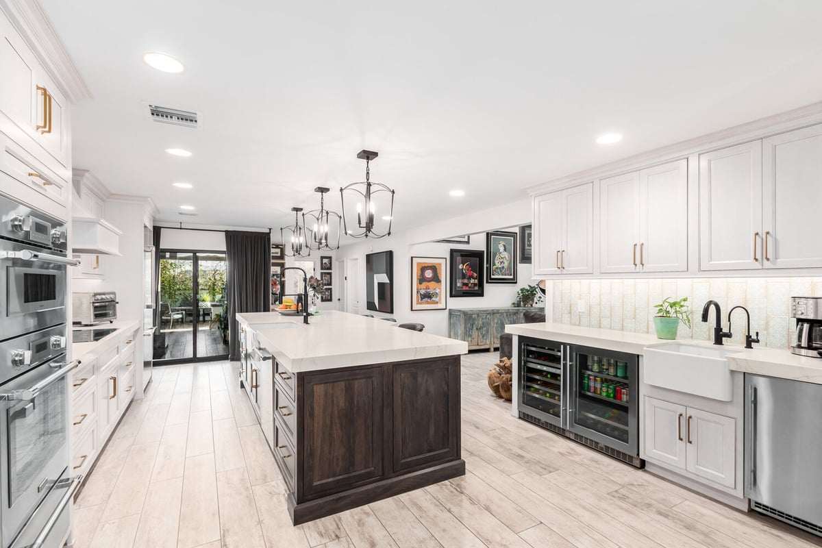 Spacious kitchen with farmhouse sink and beverage center in Glendale, AZ home by Kitchens by Good Guys.