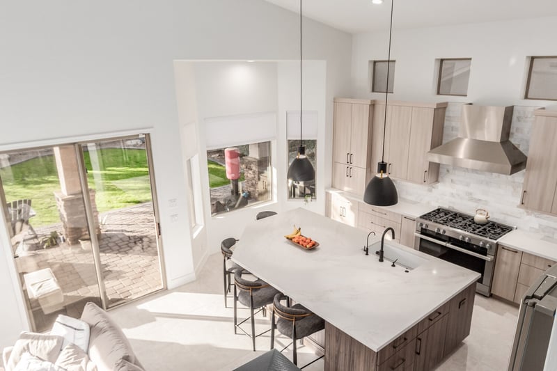 Aerial angle of custom kitchen with pendant lighting and built-in range in Phoenix, AZ by Kitchens by Good Guys.
