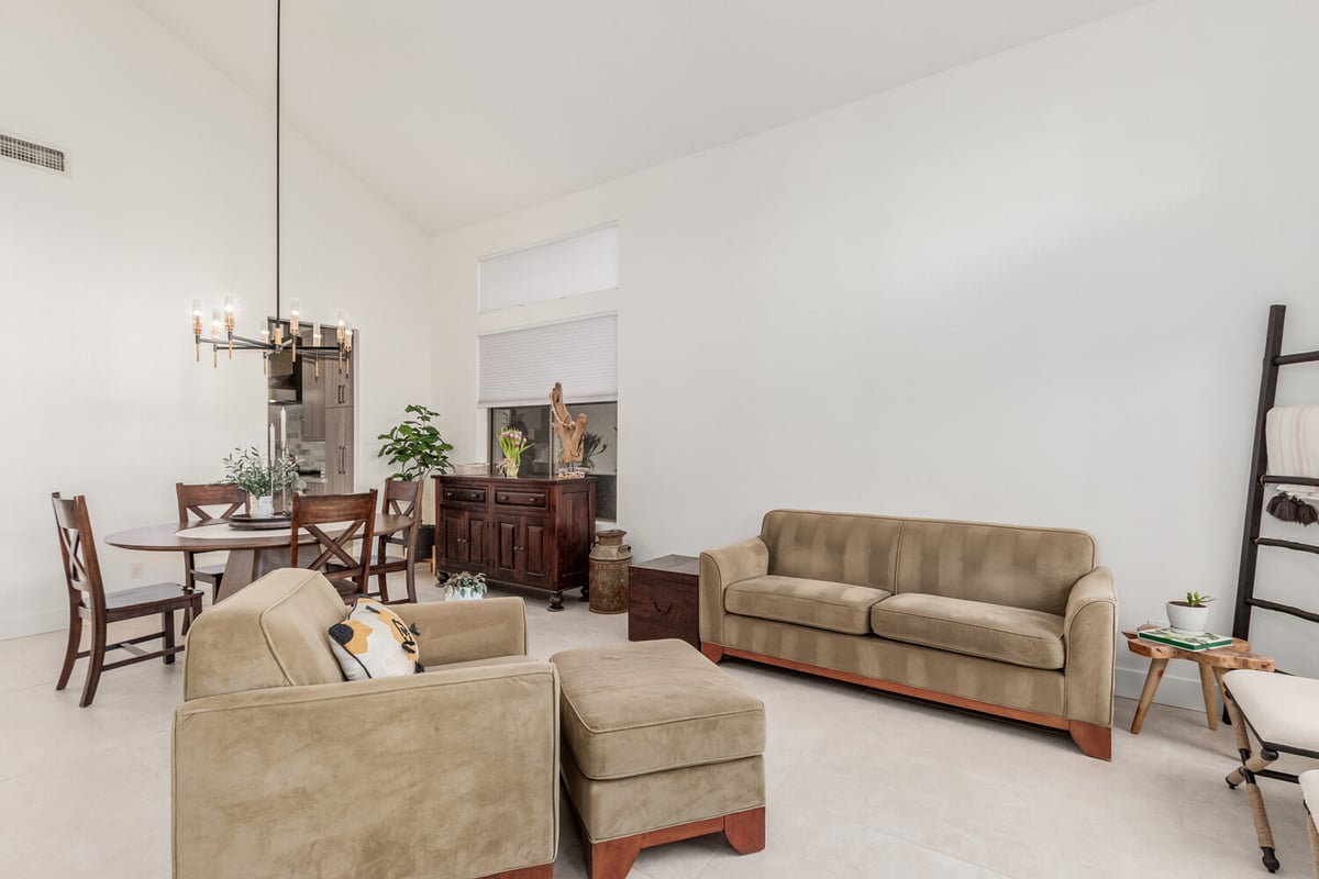 Light-filled living space and compact dining area in Scottsdale, AZ home by Kitchens by Good Guys.