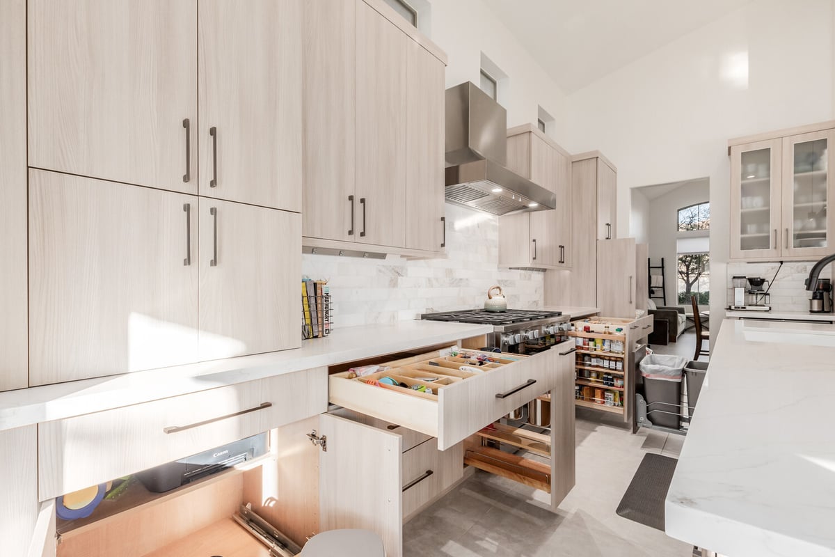 Organized custom kitchen drawers and cabinets in Paradise Valley home by Kitchens by Good Guys.