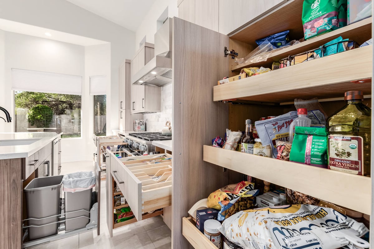 Pantry storage and cabinet organization in contemporary Paradise Valley home by Kitchens by Good Guys.
