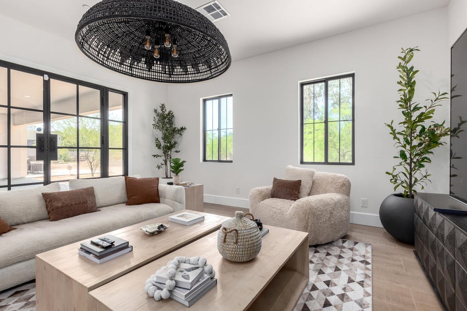Contemporary living room with natural light and modern finishes in a Scottsdale custom build.