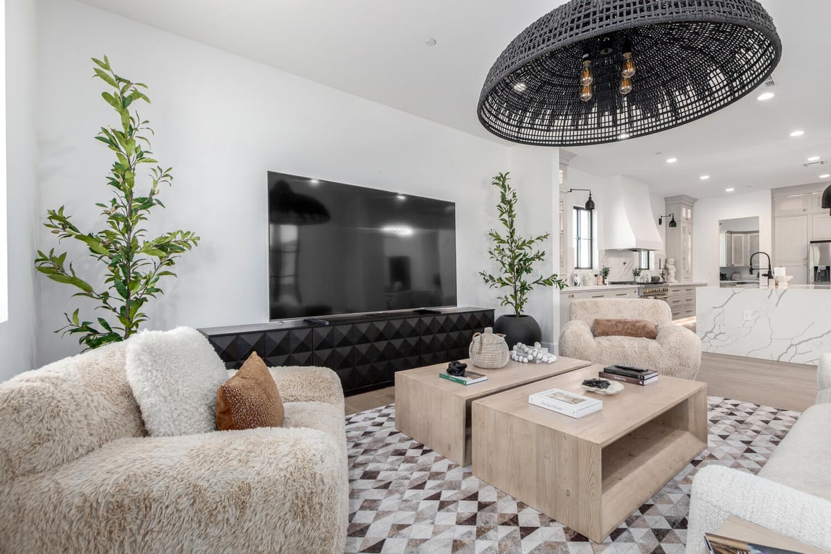 Luxurious custom home living room in Scottsdale with designer lighting and plush furnishings by Kitchens by Good Guys.