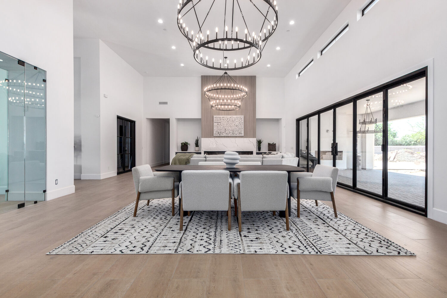 Sophisticated living and dining space with modern design in a Scottsdale, AZ custom home Sophisticated living and dining space with modern design in a Scottsdale, AZ custom home