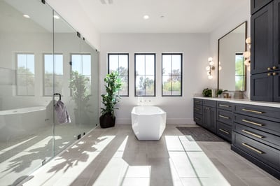 Spacious custom bathroom in Scottsdale with freestanding tub and floor-to-ceiling windows by Kitchens by Good Guys.