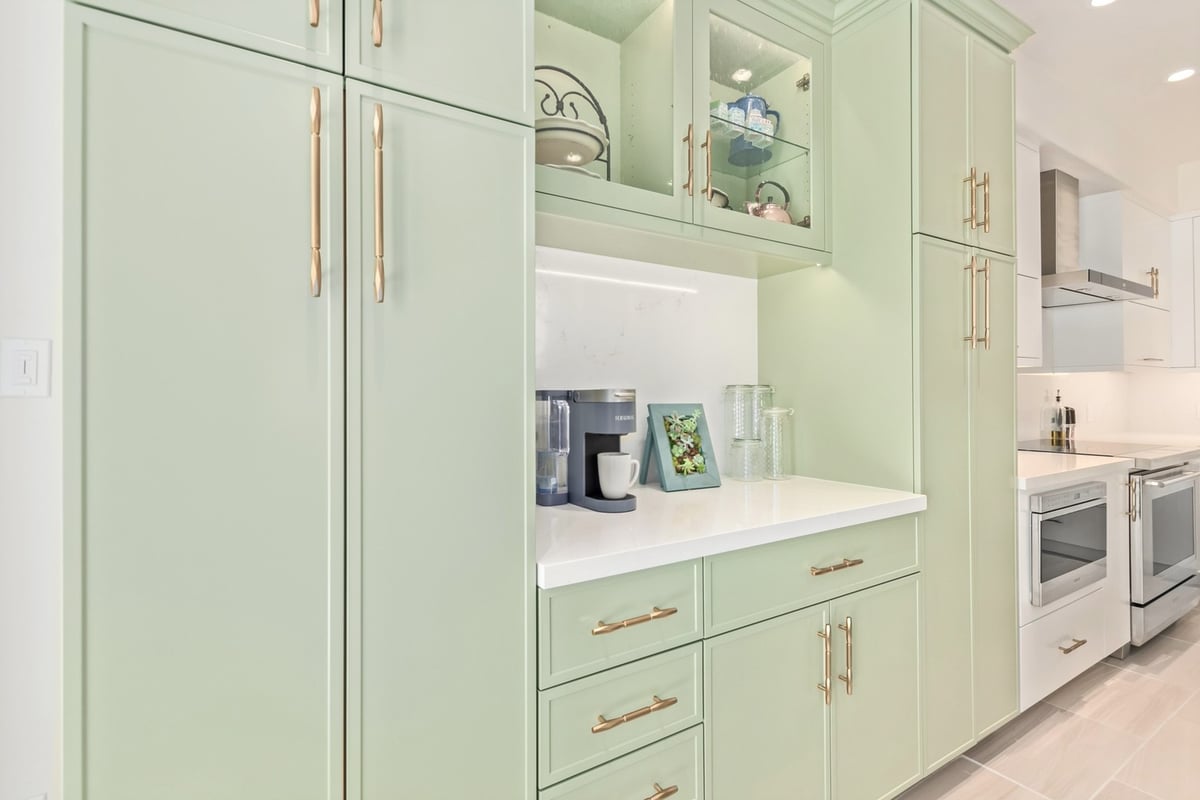 Custom kitchen cooktop with quartz backsplash and modern range in Scottsdale by Kitchens by Good Guys.