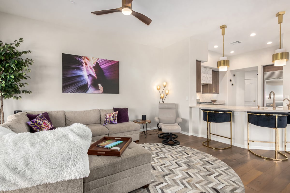 Contemporary Arizona living room featuring plush sofa and gallery-style lighting by Kitchens by Good Guys.