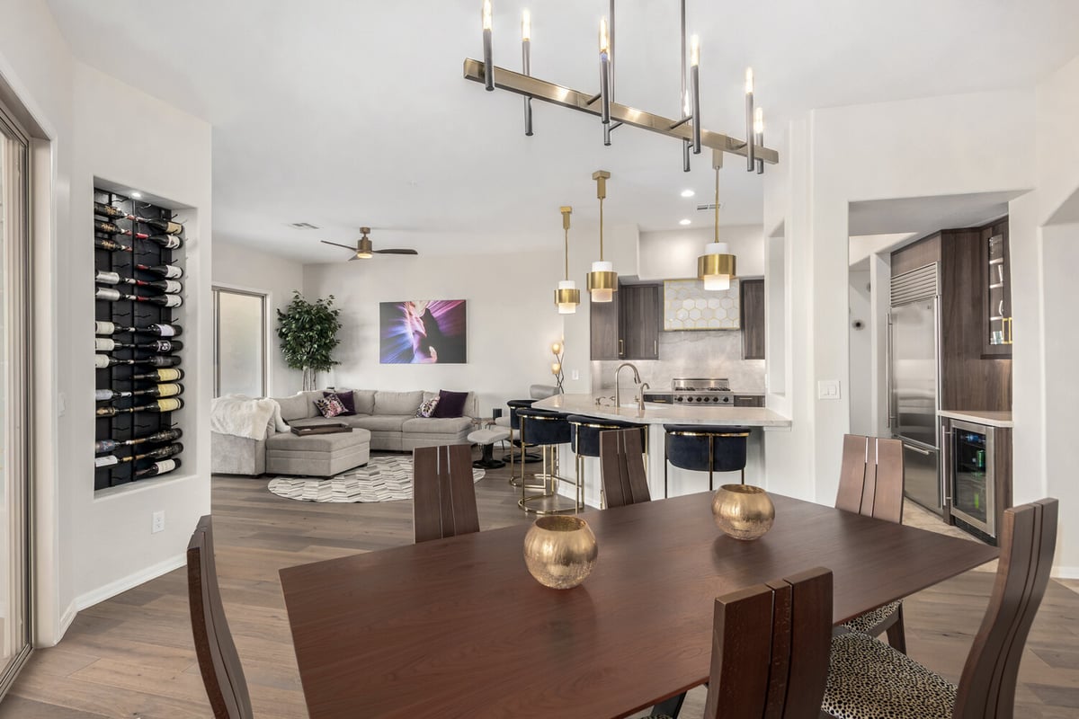 Custom home kitchen and living room with gold accents by Kitchens by Good Guys in Scottsdale, AZ.