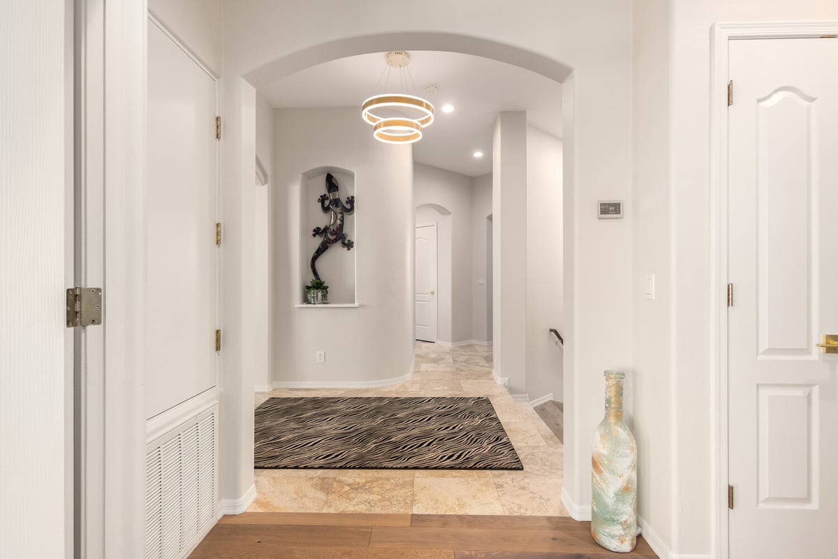 Entryway hallway remodel with tile flooring in a custom Scottsdale home by Kitchens by Good Guys.