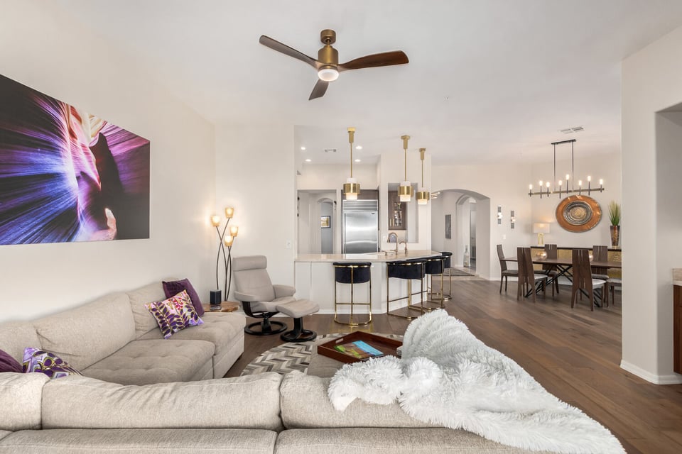 Open concept layout connecting living, kitchen, and dining areas in Phoenix home by Kitchens by Good Guys.