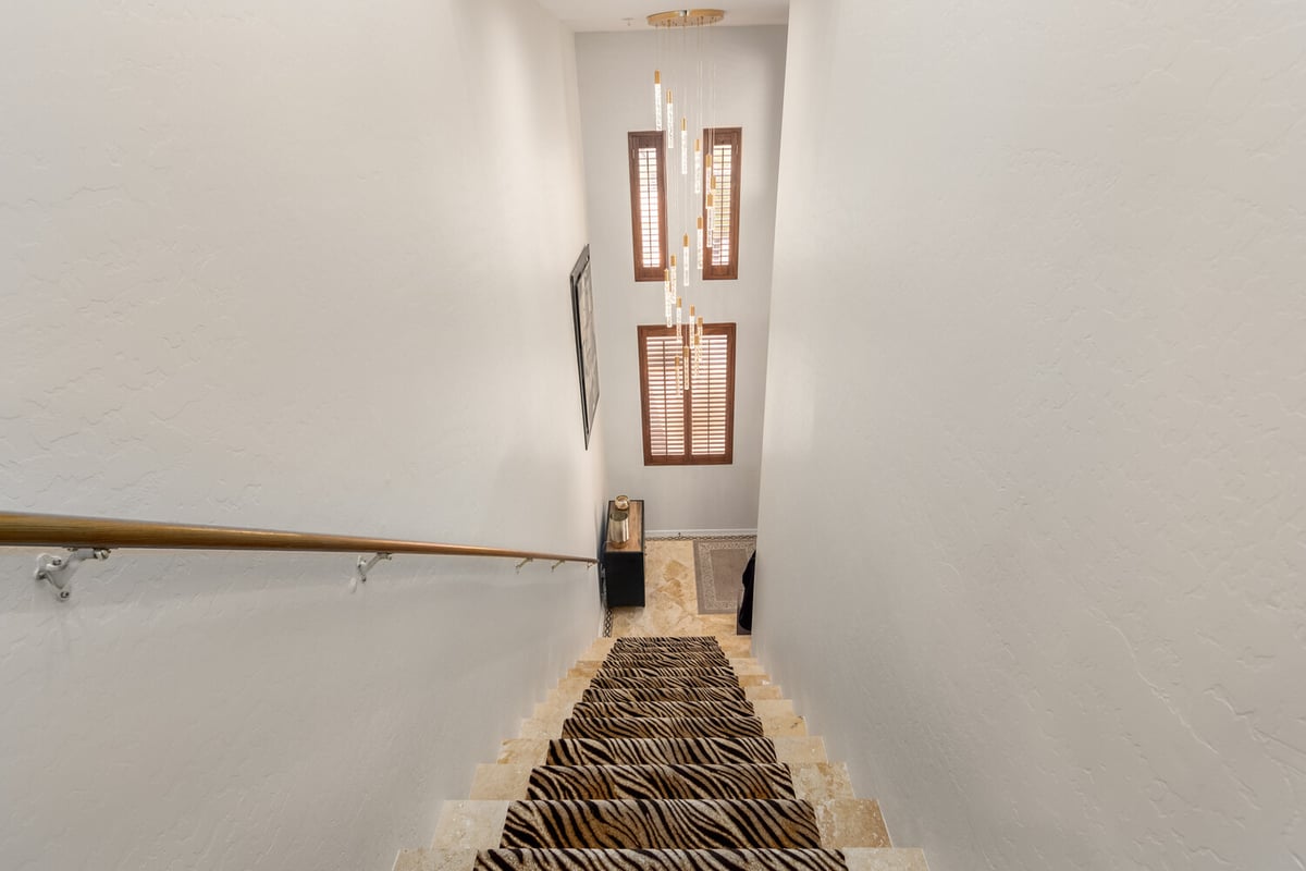 Upper landing with decorative lighting in a Paradise Valley custom home by Kitchens by Good Guys.