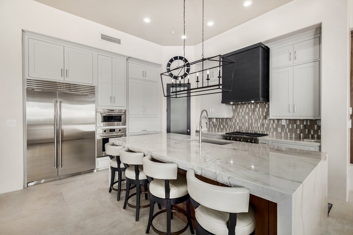Custom home kitchen in Mesa featuring soft wood finishes by Kitchens by Good Guys