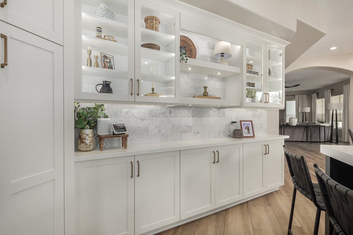 Custom built-in cabinetry with glass shelving by Kitchens by Good Guys in Scottsdale, AZ