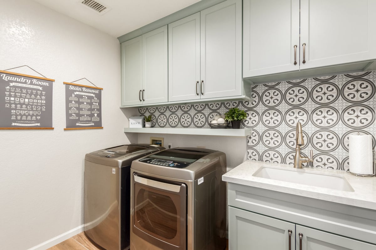 Custom laundry room design with mint cabinetry by Kitchens by Good Guys in Paradise Valley