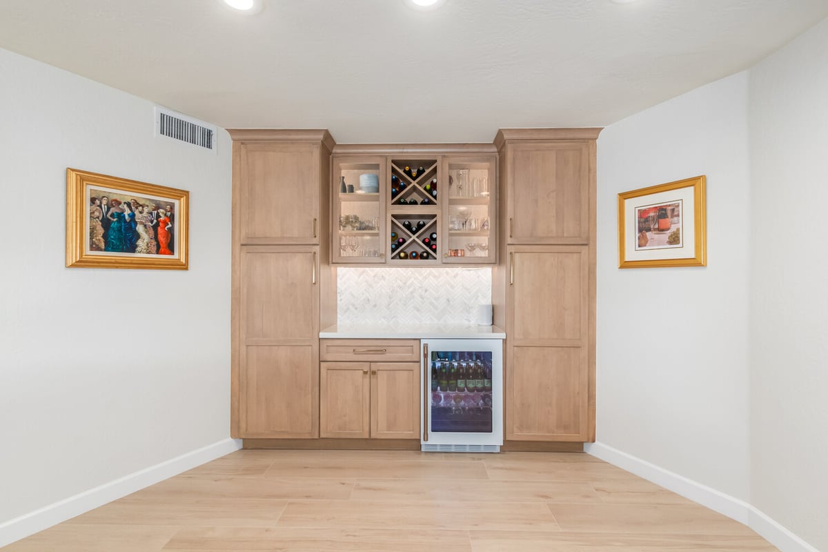 Custom wood bar cabinetry with wine fridge by Kitchens by Good Guys in Fountain Hills, AZ