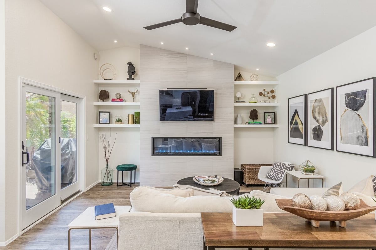 Elegant fireplace and shelving in custom home living space by Kitchens by Good Guys, Phoen