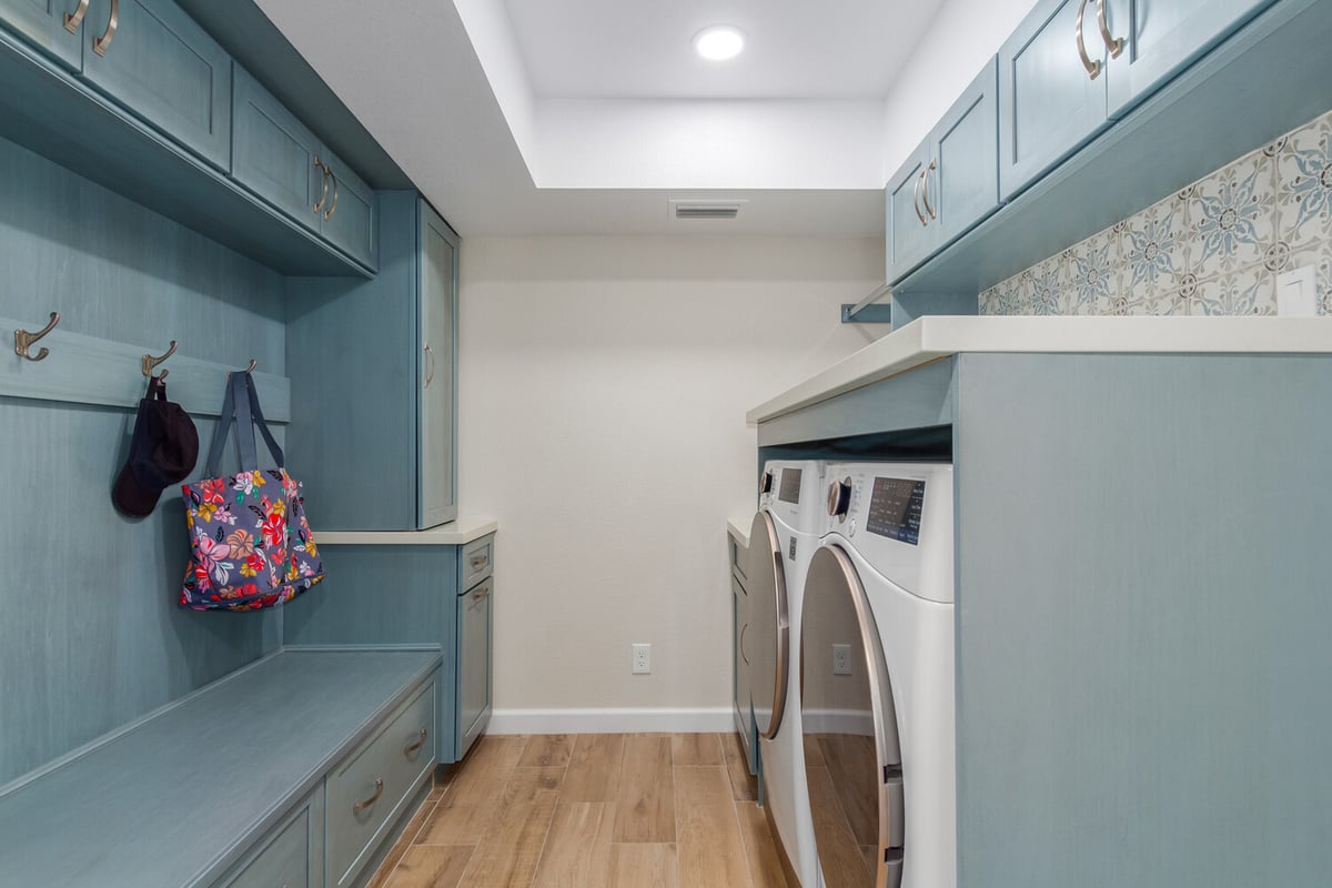 Laundry room with blue cabinetry in custom home by Kitchens by Good Guys, Fountain Hills