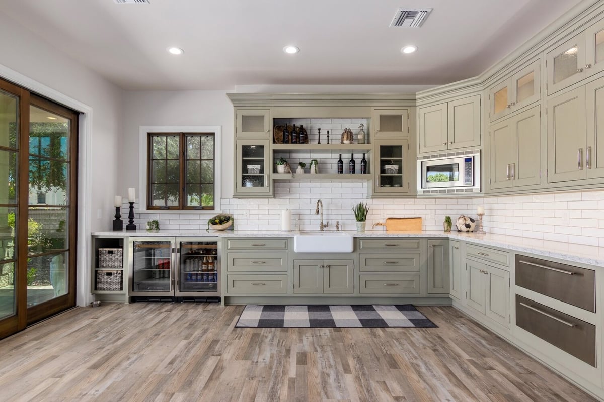 Sage green kitchen cabinetry in custom home by Kitchens by Good Guys, Scottsdale, Arizona