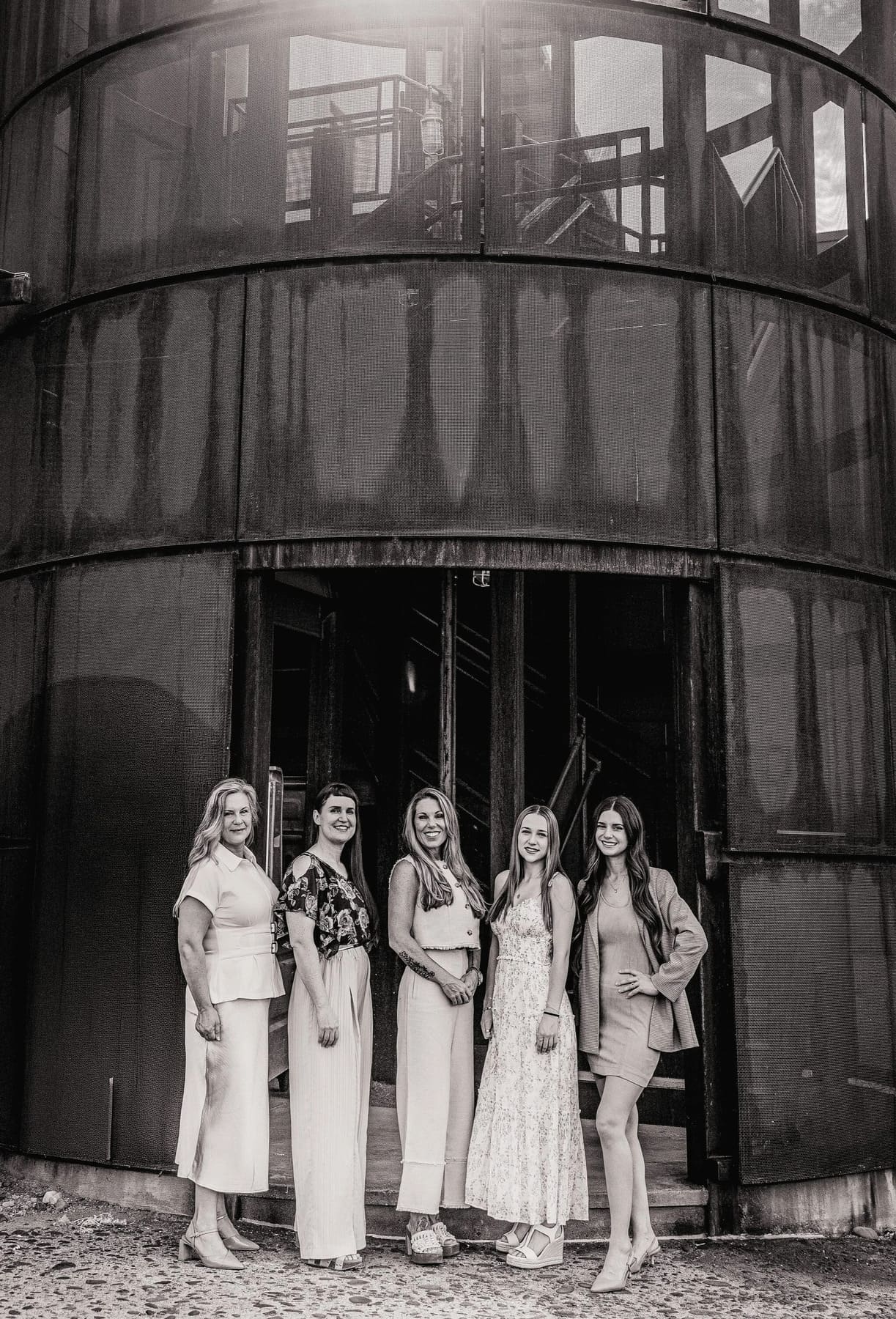 Design team of Kitchens by Goods Guys in Scottsdale, Arizona, standing together outside industrial building