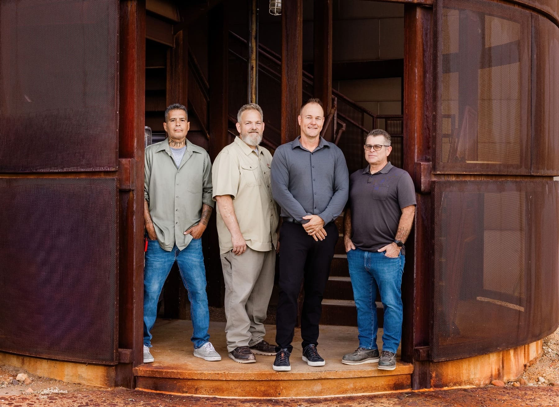 Field team of Kitchens by Goods Guys, Scottsdale AZ kitchen remodeling contractors, four men standing together.