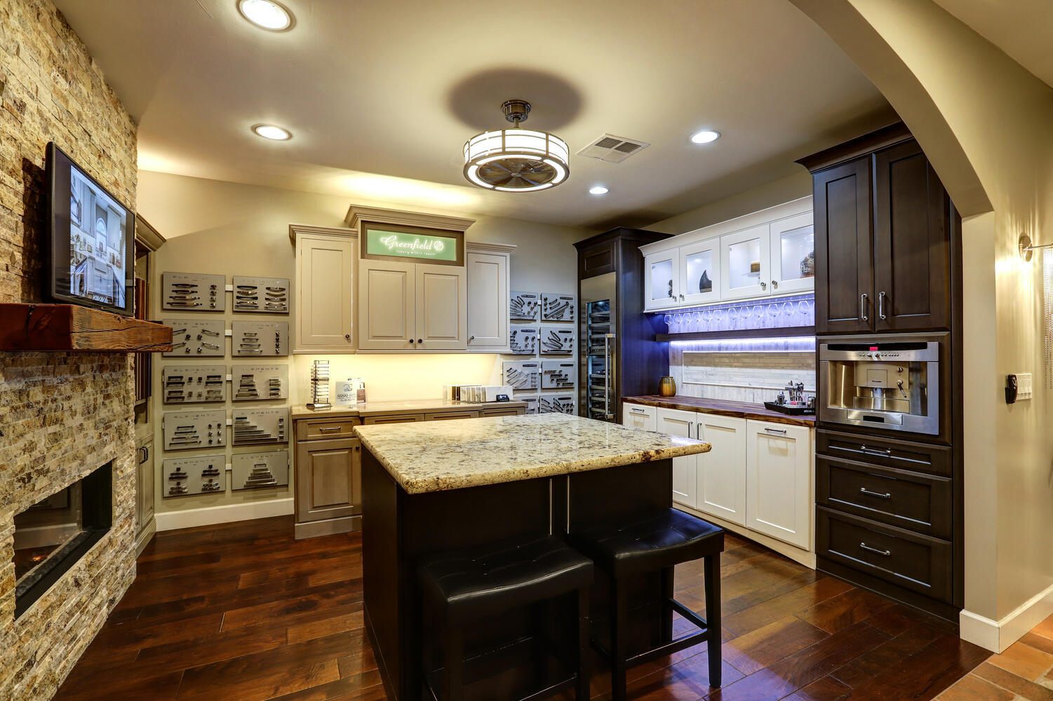 Custom kitchen showroom setup with design samples and cozy lighting at Kitchens by Good Guys