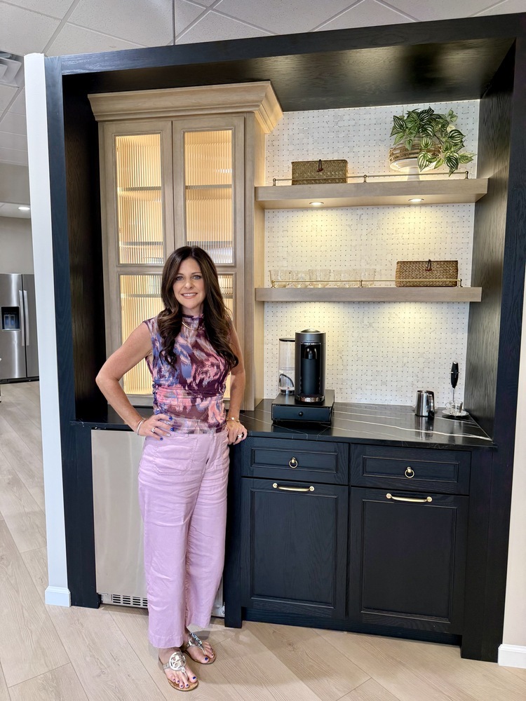 Portrait of Erin in the Kitchens by Good Guys showroom showcasing bar area cabinetry in Mesa, AZ