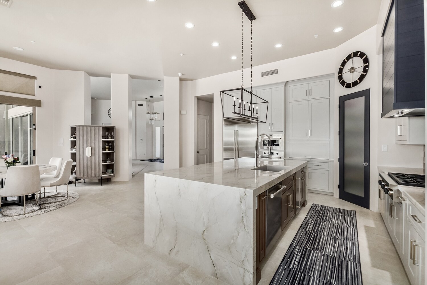Refined kitchen design with high-end finishes and center island in a Scottsdale home by Kitchens by Good Guys.