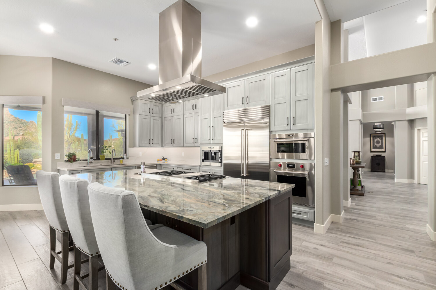 Elegant custom kitchen remodel with marble island and premium appliances by Kitchens by Good Guys in Phoenix, AZ. Elegant custom kitchen remodel with marble island and premium appliances by Kitchens by Good Guys in Phoenix, AZ.