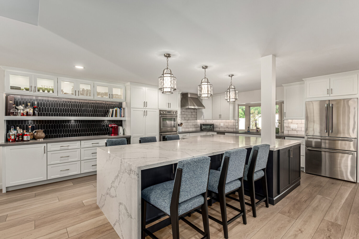 Luxury kitchen island and bar seating in a custom home remodel by Kitchens by Good Guys in Scottsdale, AZ