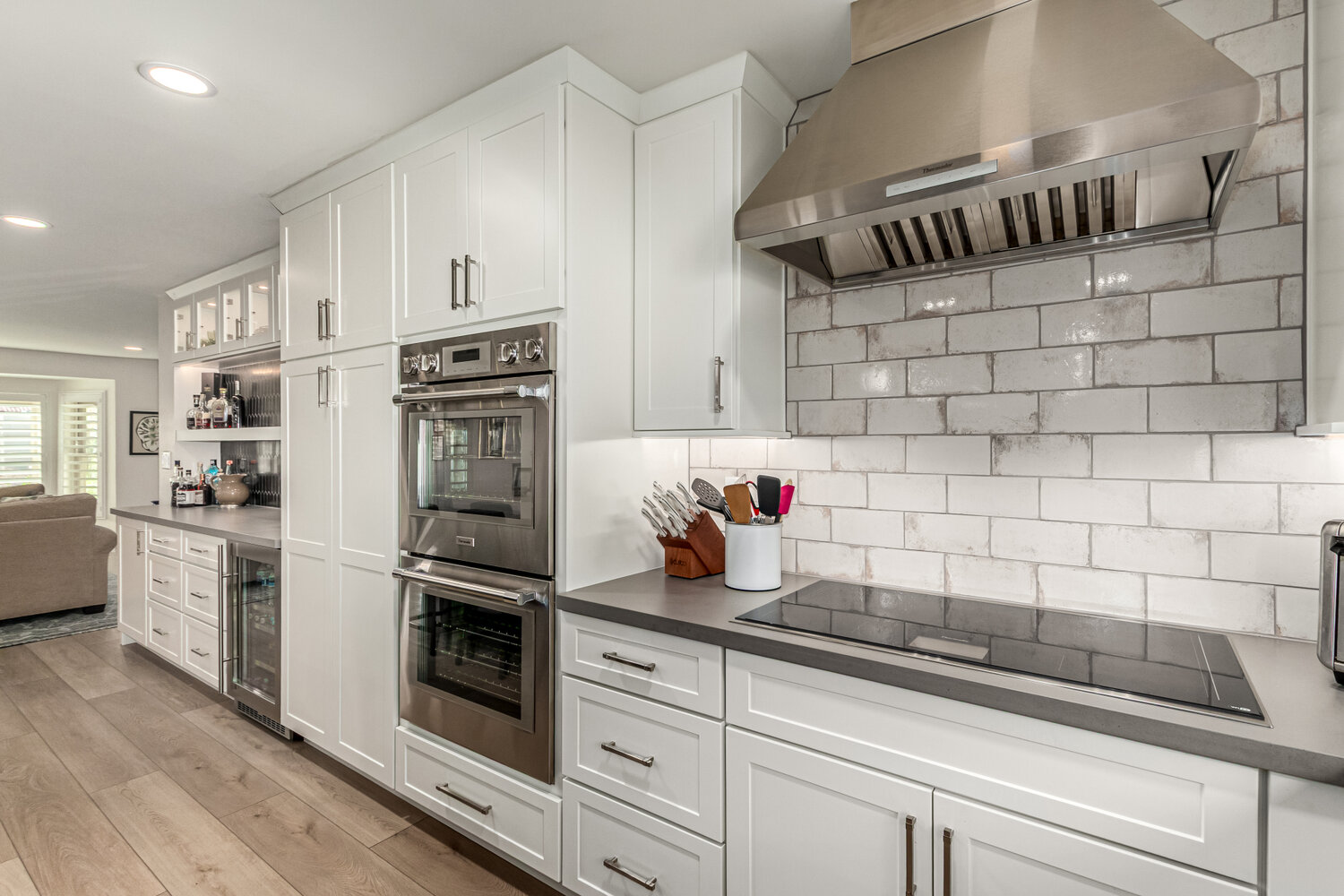 Stainless appliances and tile backsplash in custom Scottsdale home by Kitchens by Good Guys.