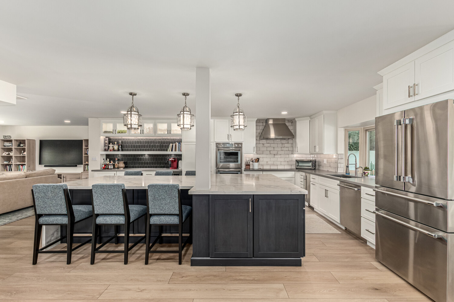 View of remodeled kitchen and living area in Scottsdale custom home by Kitchens by Good Guys.